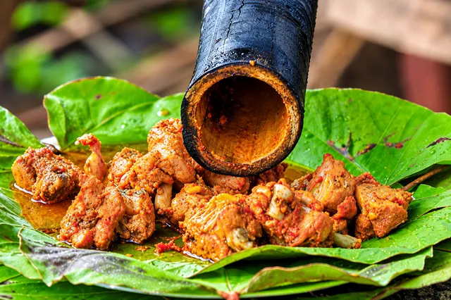 Bamboo chicken prepared over an open flame